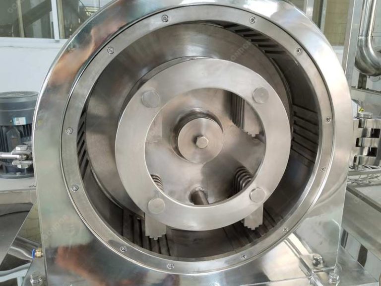 Close view of cocoa powder grinder rotor and internal grinding chamber