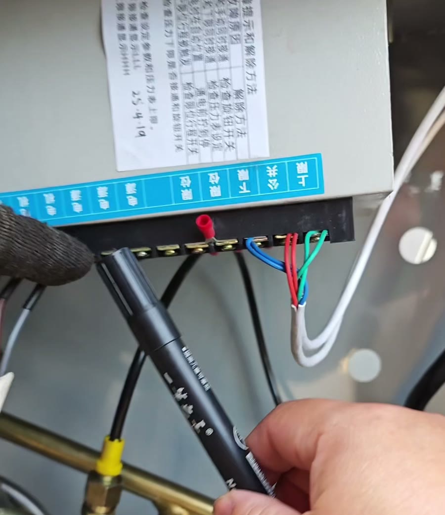 Three-phase power terminals inside the hydraulic oil press power unit